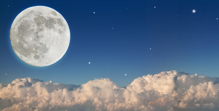 Large Moon Above Dark Clouds