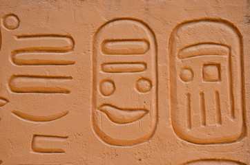 old egypt hieroglyphs carved on the stone