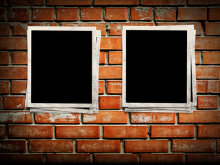 Photo frames on the brick wall