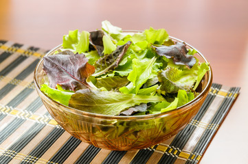 Mixed red and green salad on a table