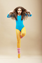 Aerobics. Gymnastics. Woman in Sportswear and Woolen Gaiters