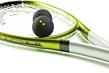 Green and silver squash racket and balls