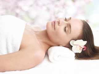 Obraz na płótnie Canvas Happy lady relaxing in massage salon