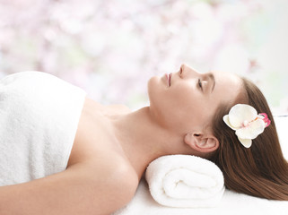 Obraz na płótnie Canvas Happy lady relaxing in massage salon