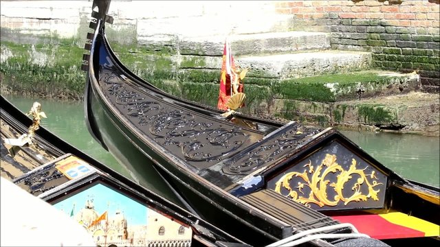 Close-up view of two gondolas in a channel in Venice