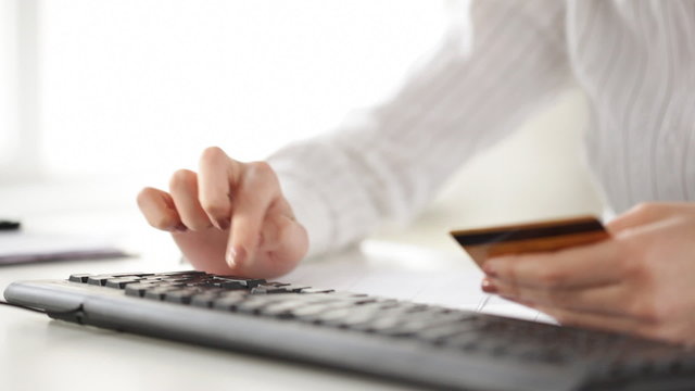 woman with credit card making internet shopping