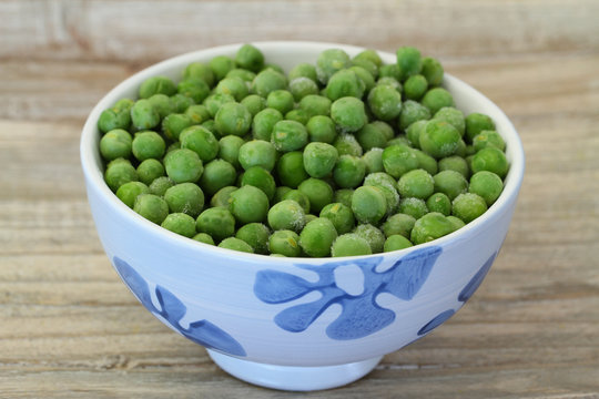 Bowl of frozen green peas, close up