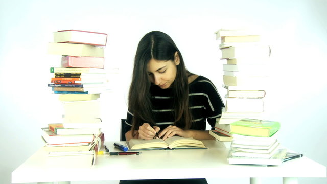 Young woman studying hard at home
