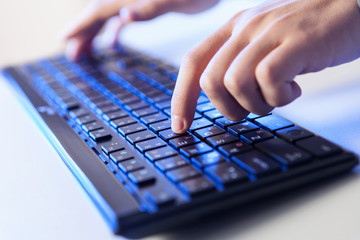 Click! Hands of a man on keyboard