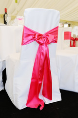 Chair cover with pink bow