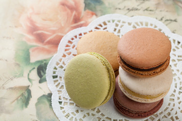 Delicious macaroons on vintage background