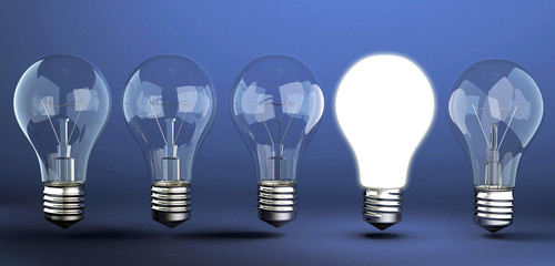 Light bulb on blue background