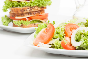 Salad and sandwiches. Selective focus
