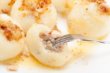 Meat stuffed dumplings with fried onion