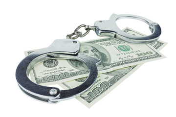Handcuffs with money isolated in white background