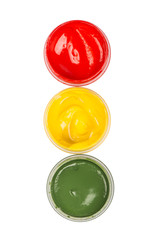 three paint cans like traffic light isolated on white