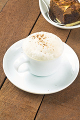 Cup of latte macchiato with cocoa powder