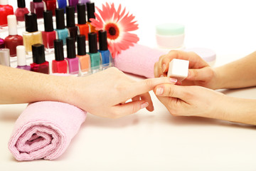 Manicure process in beauty salon, close up