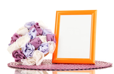 Colorful photo frame and flowers isolated on white
