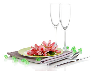 Festive table setting with flowers isolated on white
