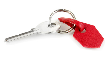Key with leather trinket isolated on white