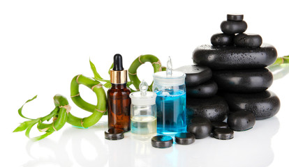 Spas composition with oils and spa stones isolated on white