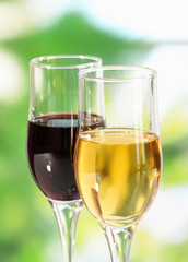 Wine in glasses on nature background