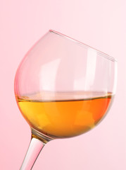 Wine in glasses on pink background