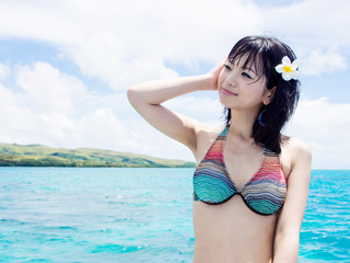 a beautiful asian woman in the ocean