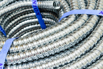 Close up Metal cable protection conduit electric line.