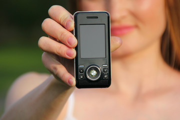 Young girl holding phone