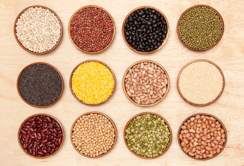 collection set of beans, peas and sesame in wooden bowl.