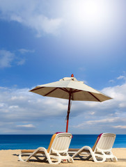 beds and umbrella on the beach