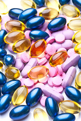 colorful vitamin gel capsules isolated on whiteback ground 