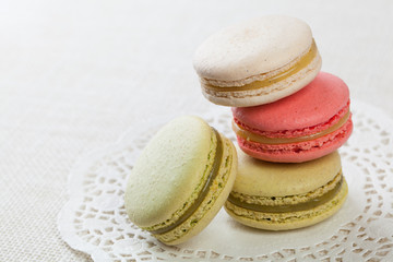 Delicious macaroons on vintage background