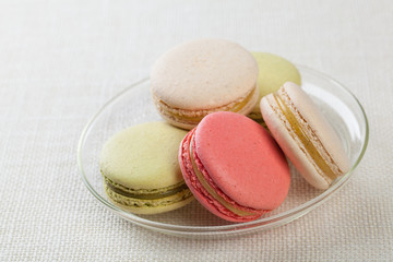Delicious macaroons on vintage background