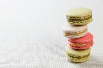 Delicious macaroons on vintage background