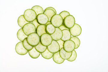 Freshly sliced cucumber  isolated on white background
