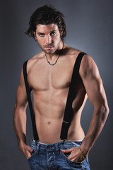 Fototapeta na wymiar Sexy shirtless man with suspenders