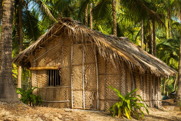 Fototapeta na wymiar Straw hut on Paradise beach in Goa, India