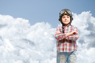 Boy in helmet pilot dreaming of becoming a pilot