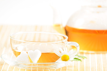 teacup with herbal chamomile tea