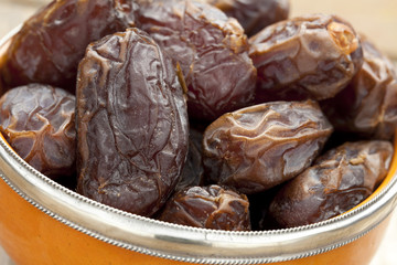 Orange bowl with dates
