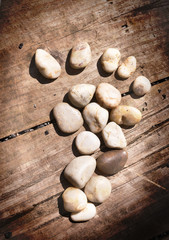 Stone Footprint on Wood Background