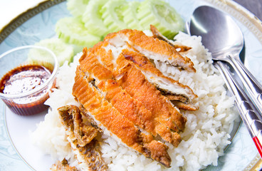 Fish Fried with spicy sauce on cokked jusmine rice