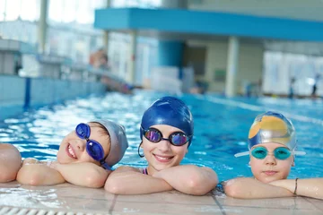 Fotobehang happy children group  at swimming pool © .shock
