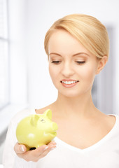lovely woman with piggy bank