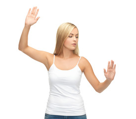 woman in white t-shirt pressing imaginary button