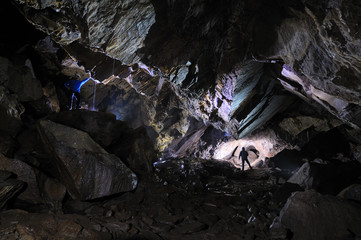 2 Caver in a cave, Pugnetto, Mezzenile, Piedmont, Italy