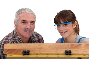 Carpenter working with his daughter